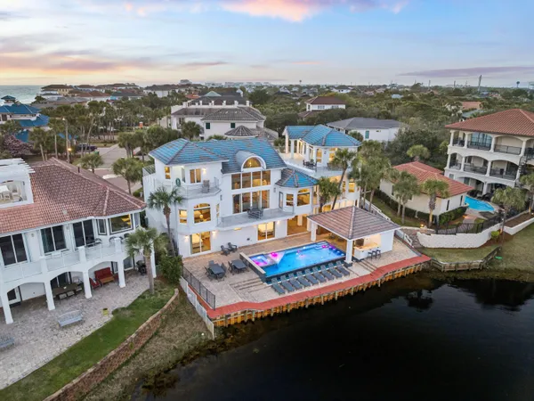 an aerial view of a house with a ocean view
