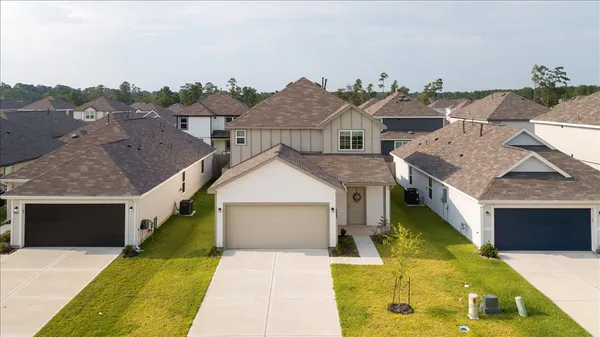 a aerial view of a house with swimming pool