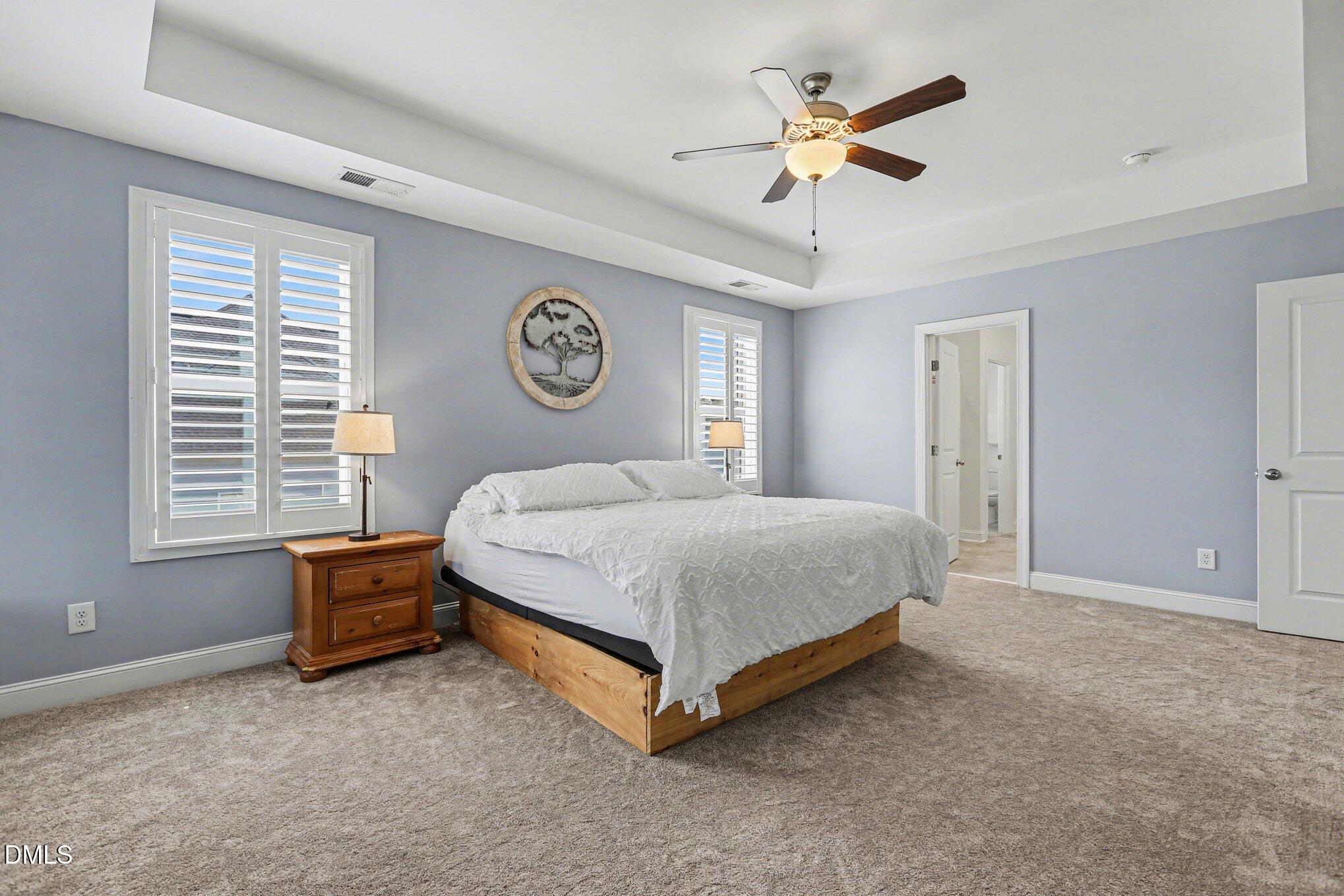 432 Seabring Lane Raleigh, NC 27603 - Photo 16 of 29 a bedroom with a bed and a ceiling fan