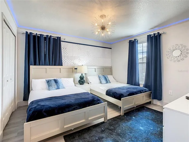 a bedroom with bed and a window