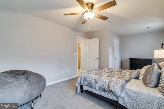 a bathroom with a white toilet and sink
