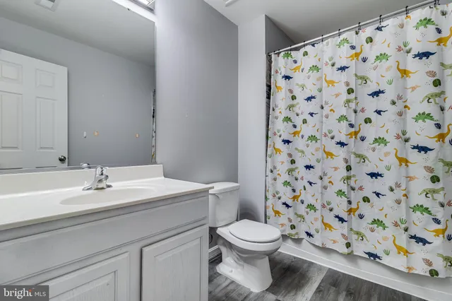 a bedroom with two beds and painted walls