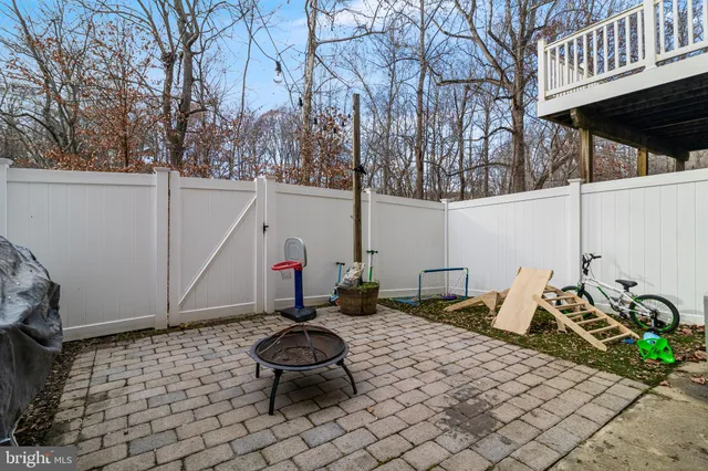 a view of a patio with table and chairs