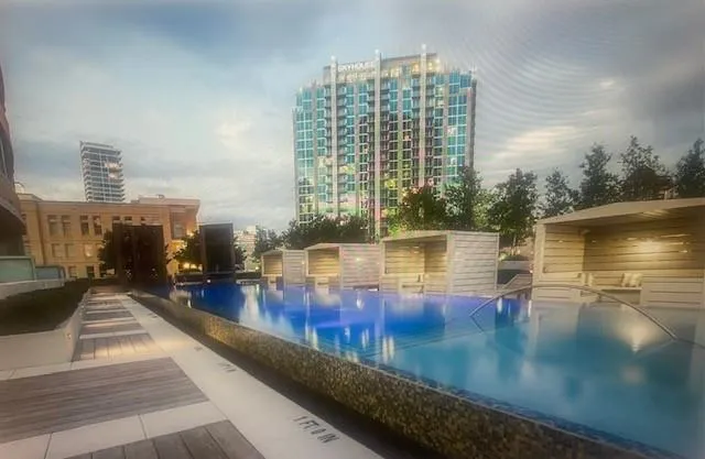 a view of a swimming pool with outdoor seating