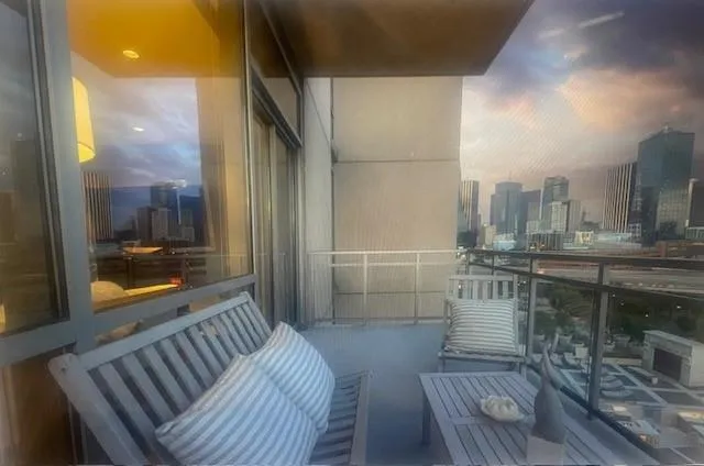 a bathroom with a glass door shower and a sink