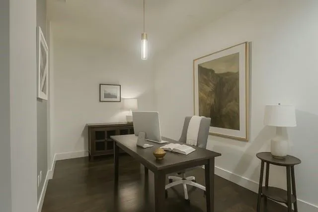 a view of a workspace with furniture