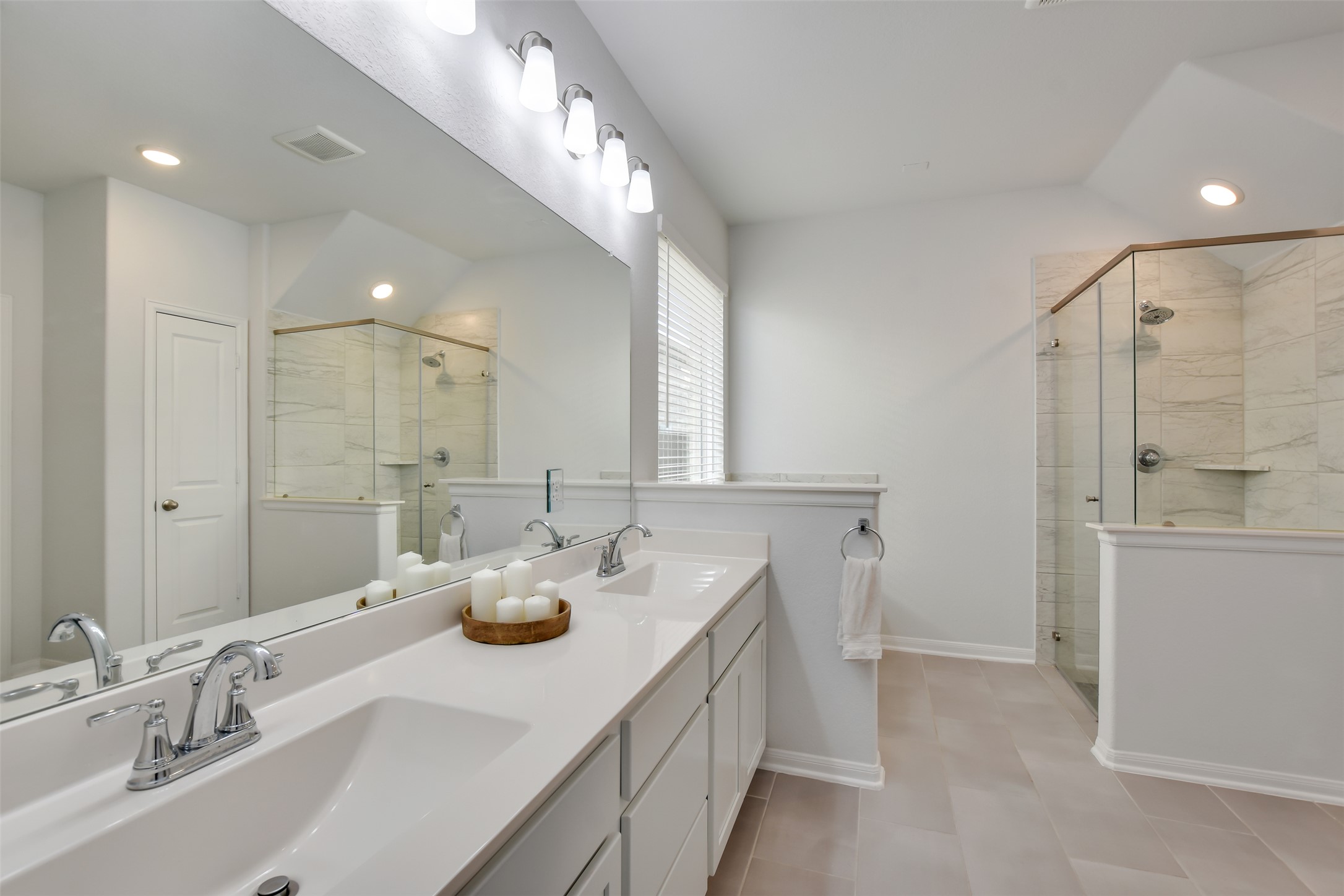 605 Oleander Loop Buda, TX 78610 - Photo 19 of 32 a bathroom with a sink double vanity granite and a mirror