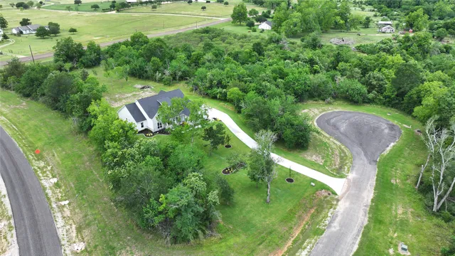 a view of a garden with a building in the background