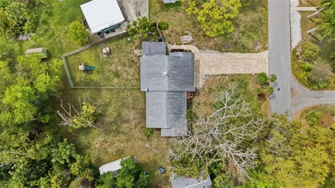an aerial view of residential house with outdoor space