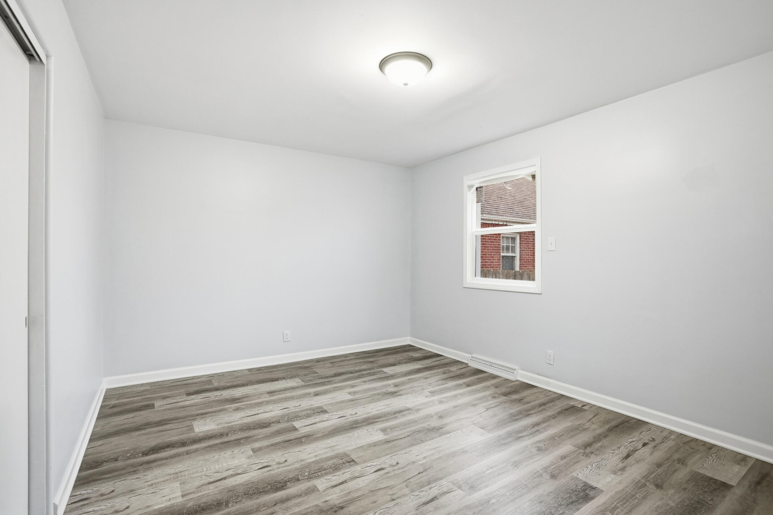 4800 Adams Street Gary, IN 46408 - Photo 13 of 24 a view of a room with wooden floor and natural light