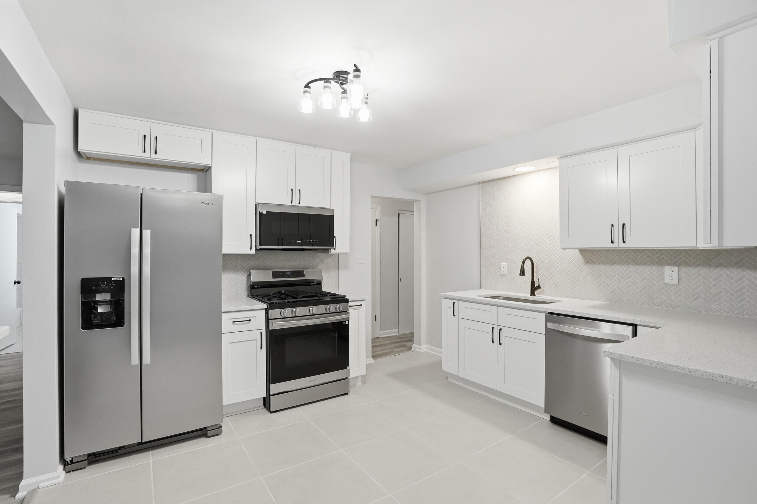 4800 Adams Street Gary, IN 46408 - Photo 2 of 24 a kitchen with stainless steel appliances granite countertop a refrigerator stove and sink