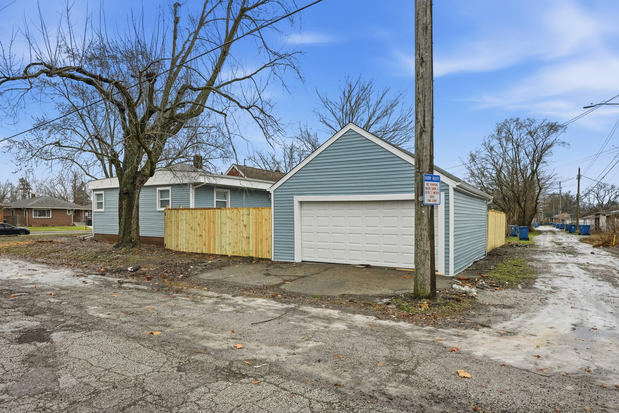 4800 Adams Street Gary, IN 46408 - Photo 21 of 24 a view of a house with a yard and garage