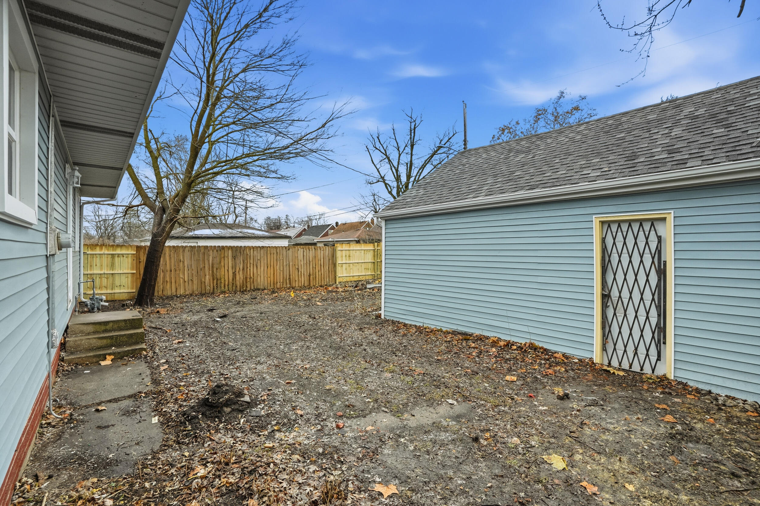 4800 Adams Street Gary, IN 46408 - Photo 22 of 24 a view of a backyard with large trees