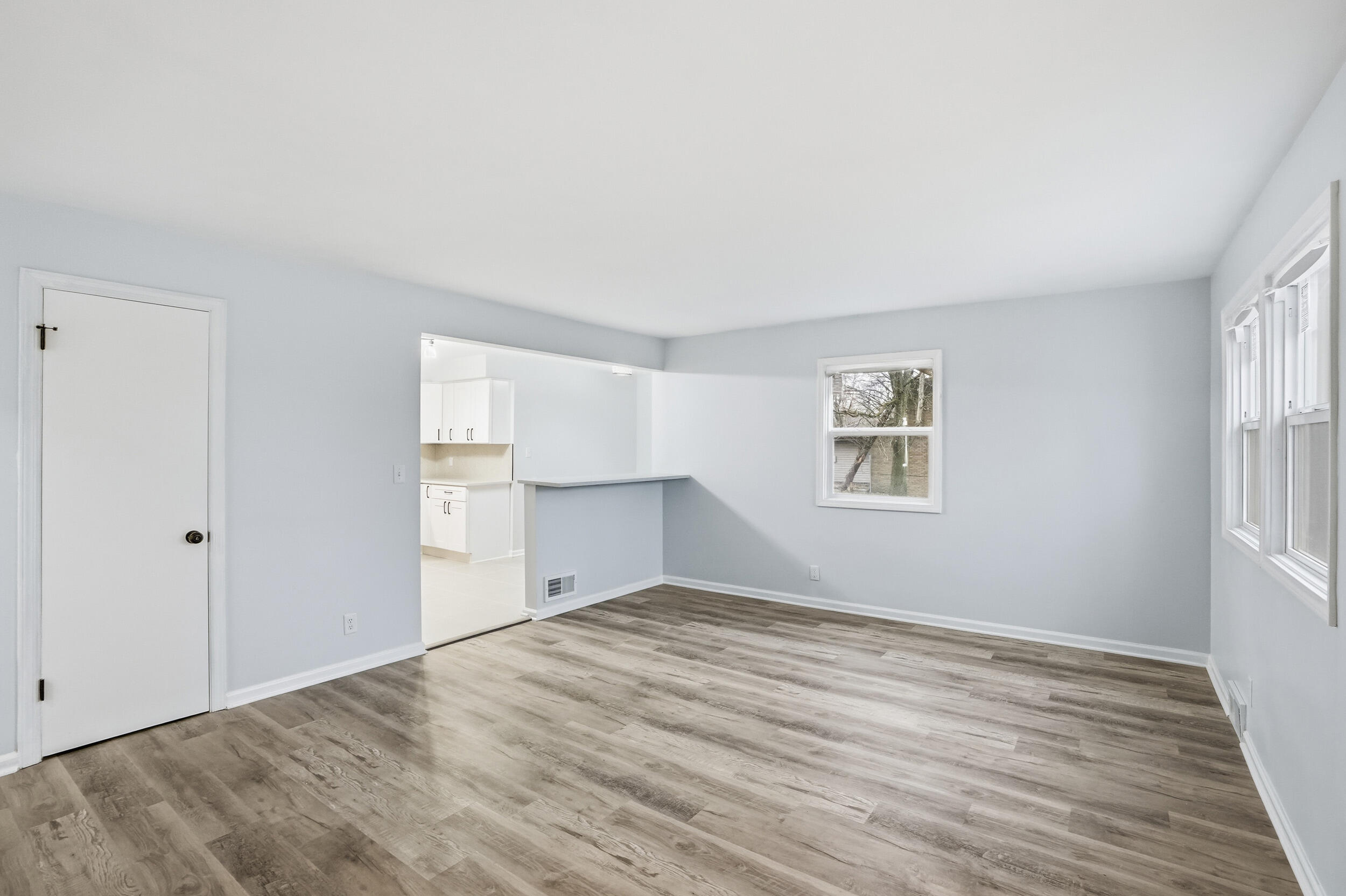 4800 Adams Street Gary, IN 46408 - Photo 7 of 24 a view of empty room with wooden floor and fan