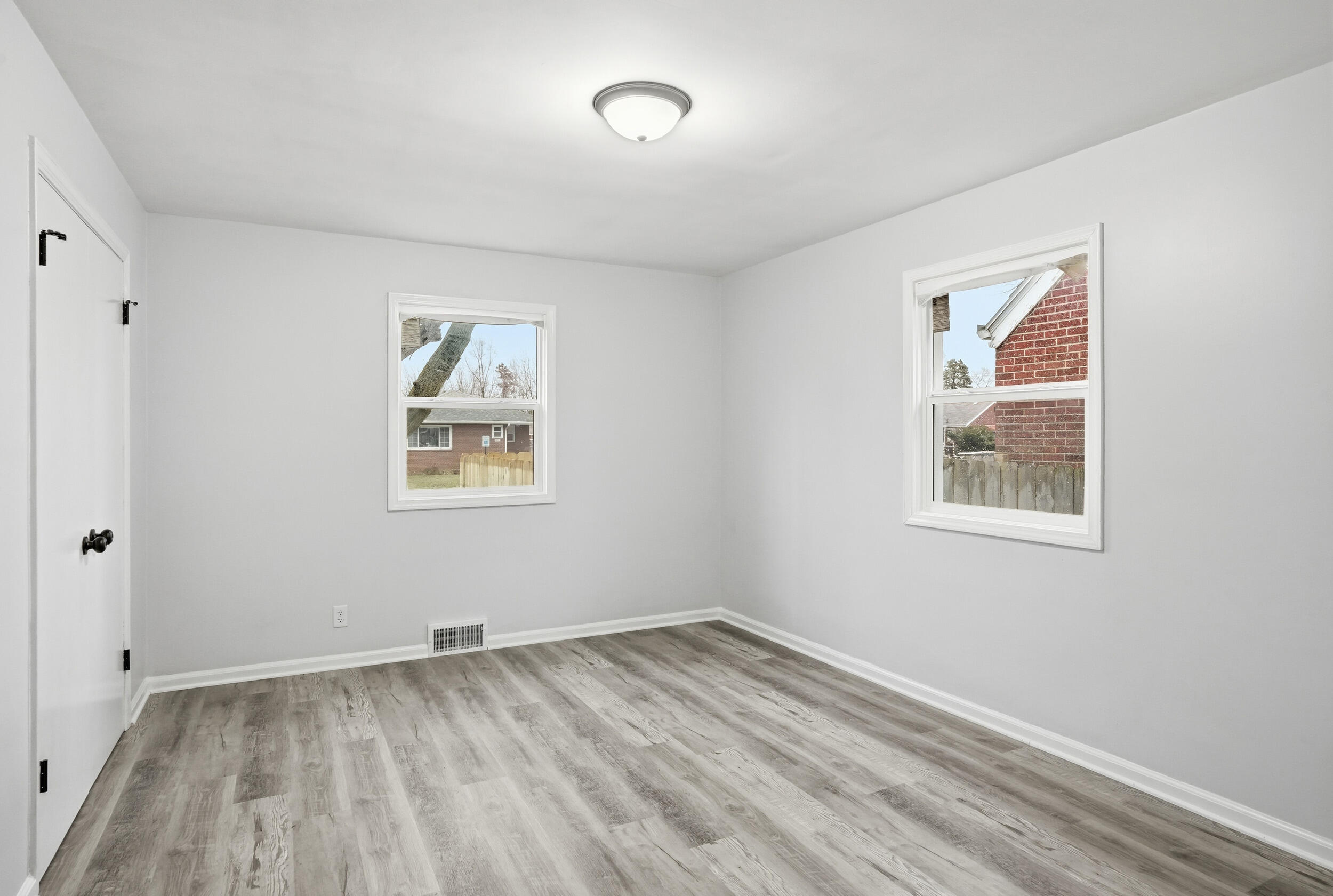 4800 Adams Street Gary, IN 46408 - Photo 10 of 24 a view of empty room with wooden floor