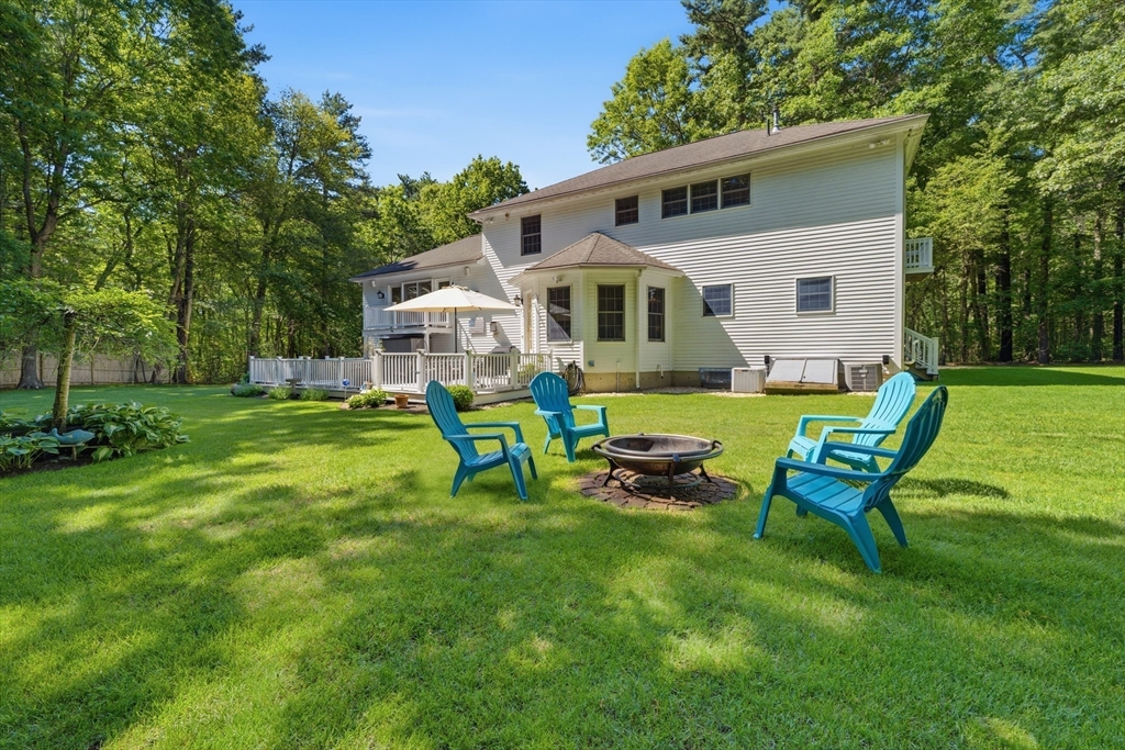 25 Haymeadow Road Boxford, MA 01921 - Photo 32 of 42 a view of a house with backyard sitting area and garden