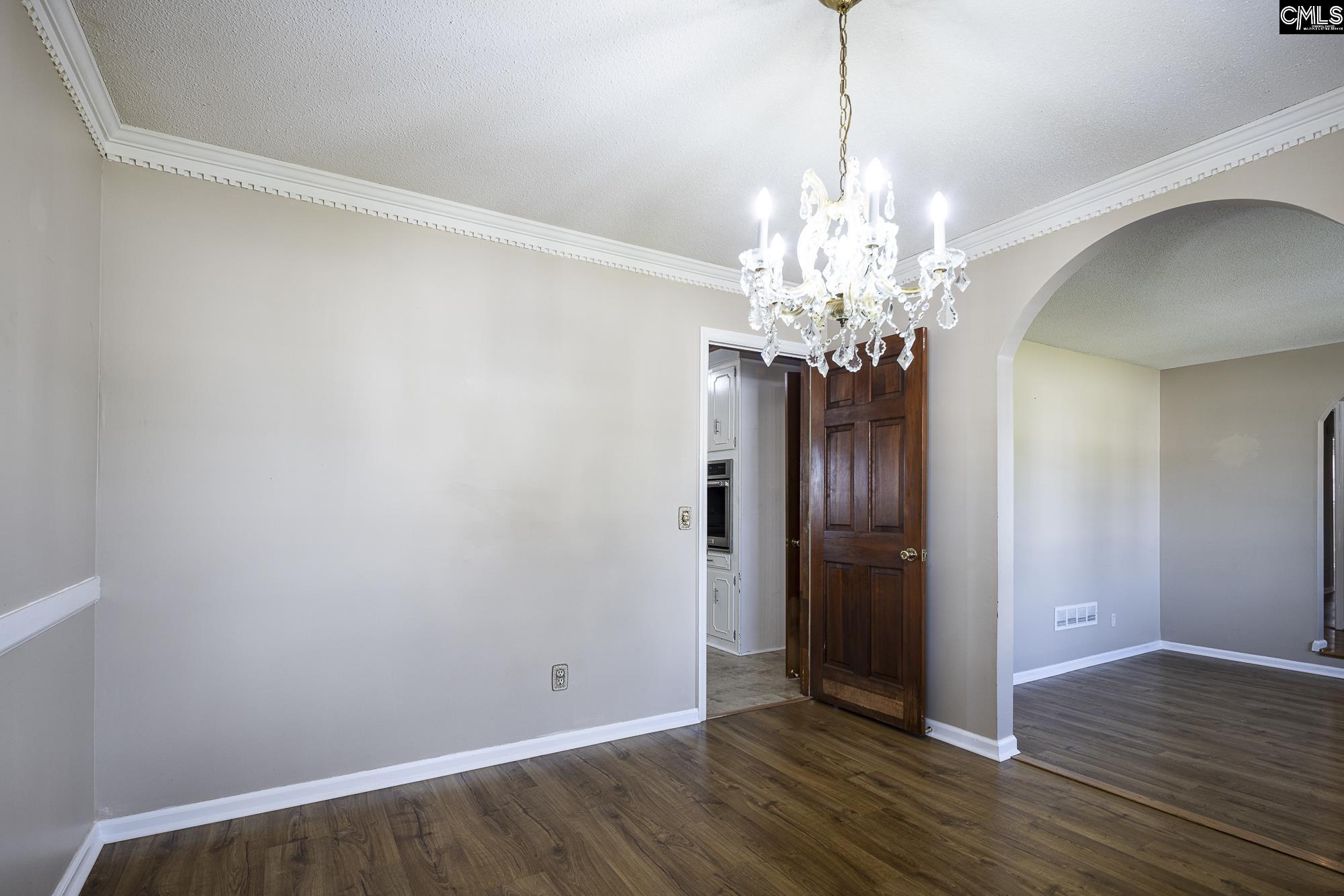 4083 Platt Springs Road West Columbia, SC 29170 - Photo 7 of 35 a view of a chandelier in big room and wooden floor
