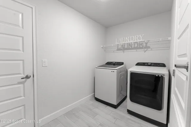 a utility room with dryer and washer