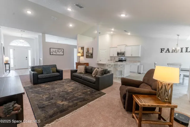 a living room with furniture and a couch