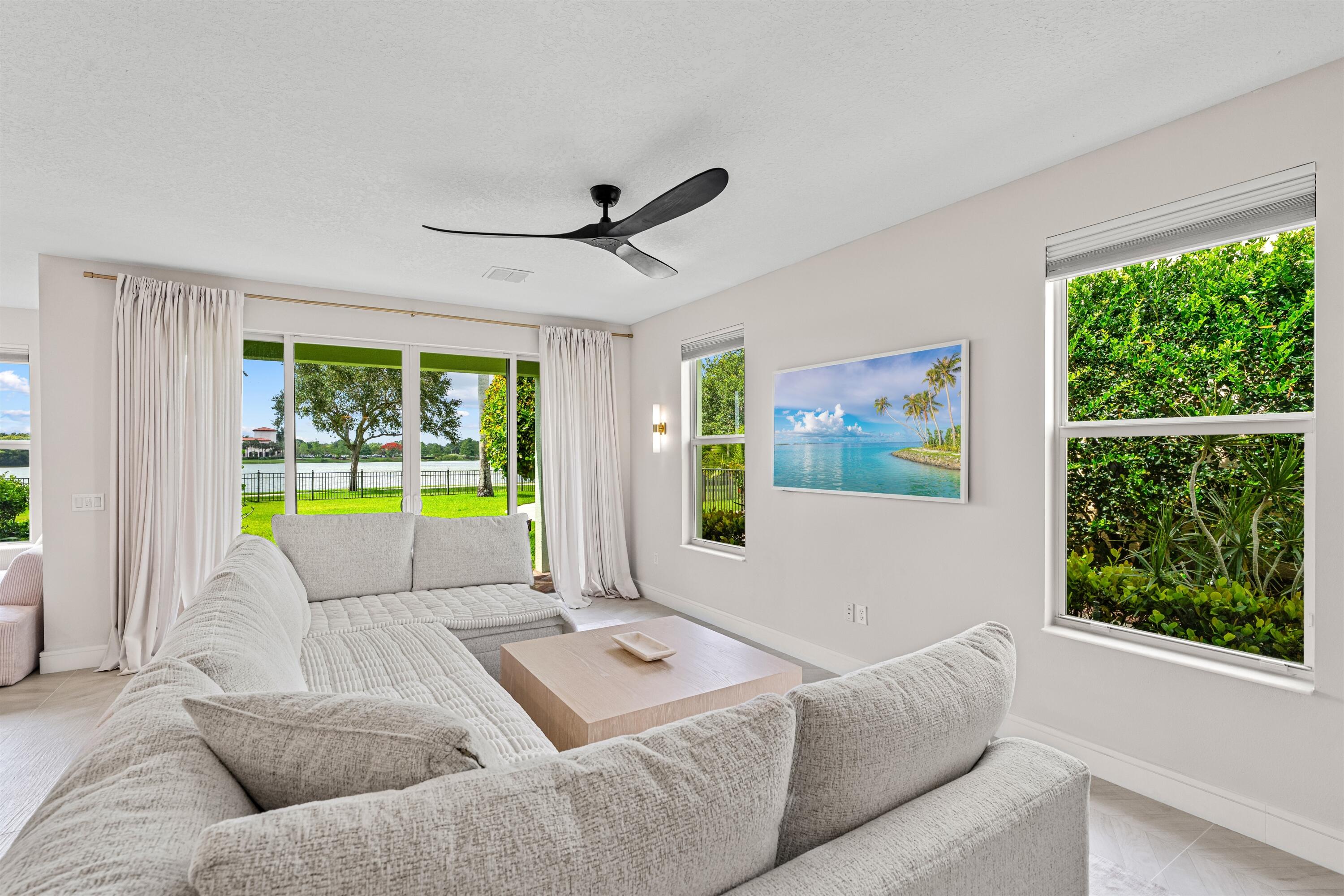 1570 Northwest 48th Place Boca Raton, FL 33431 - Photo 11 of 30 a living room with furniture and a large window