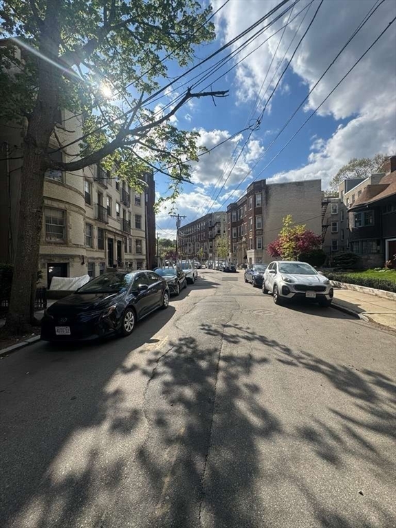 98 Strathmore Road, Unit 2 Boston, MA 02135 - Photo 11 of 11 a view of parking with cars parked