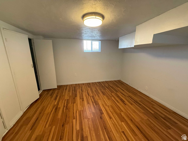73 Garden Street Helper, UT 84526 - Photo 22 of 36 Basement with wood finished floors and a textured ceiling