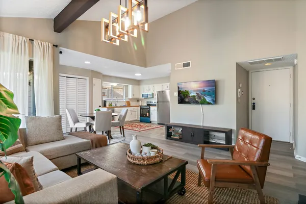 a living room with furniture and a flat screen tv