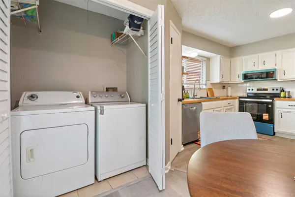 a view of kitchen and washer and dryer