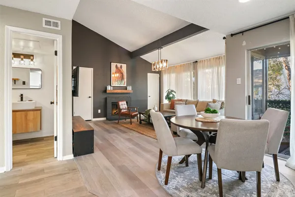 a view of a dining room with furniture and a table