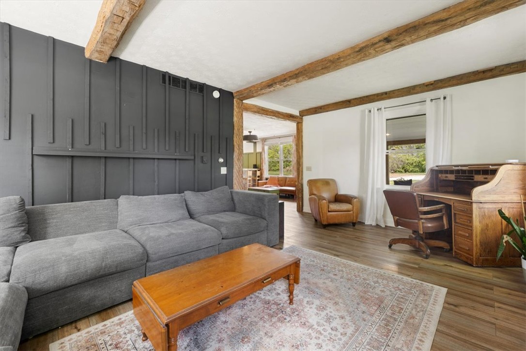 5120 Wheelock Road Troy, OH 45373 - Photo 11 of 67 This inviting living space features exposed beam ceilings and warm wood flooring.