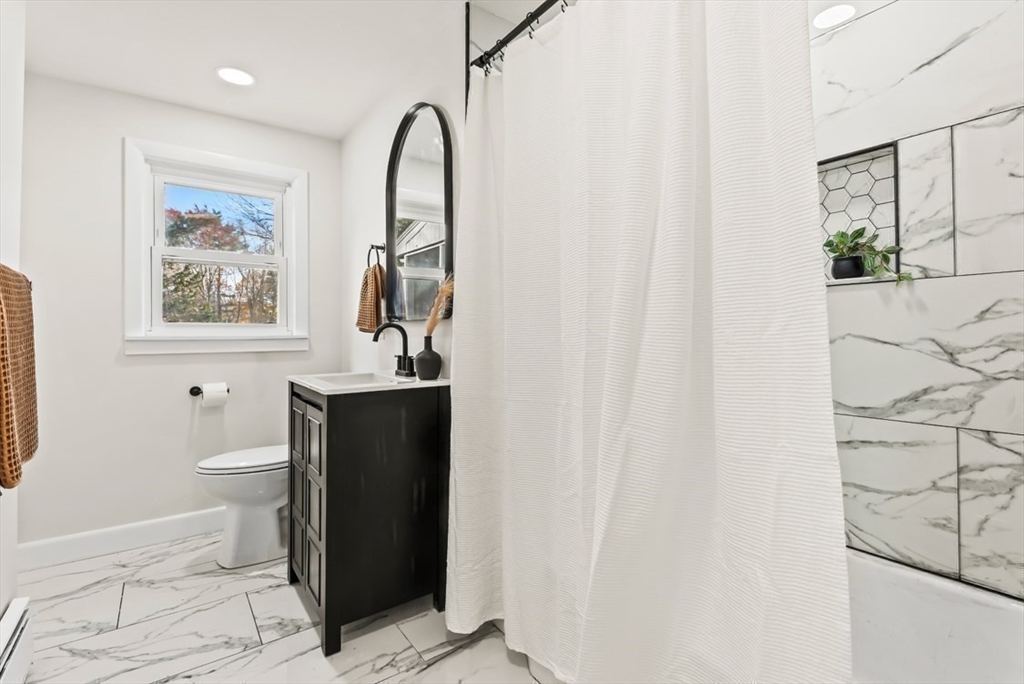 1156 Washington Street Walpole, MA 02081 - Photo 12 of 26 a bathroom with a sink a toilet and shower