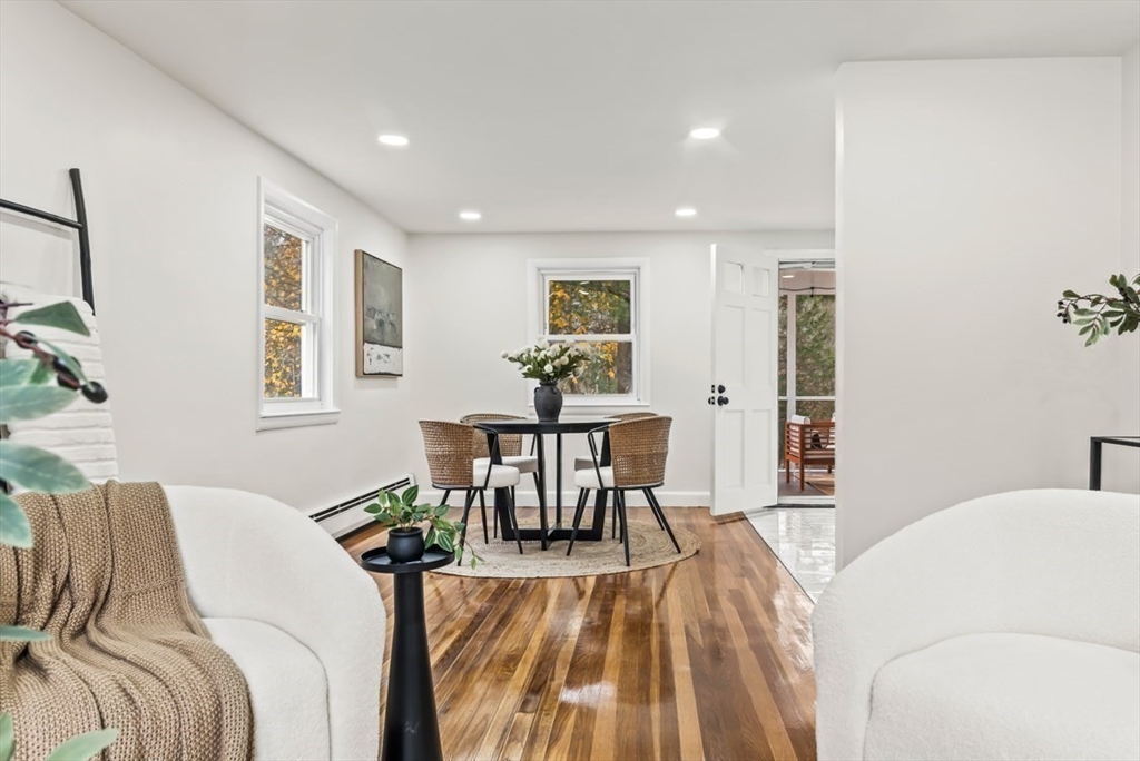 1156 Washington Street Walpole, MA 02081 - Photo 4 of 26 a bed room with a bed and a table chair