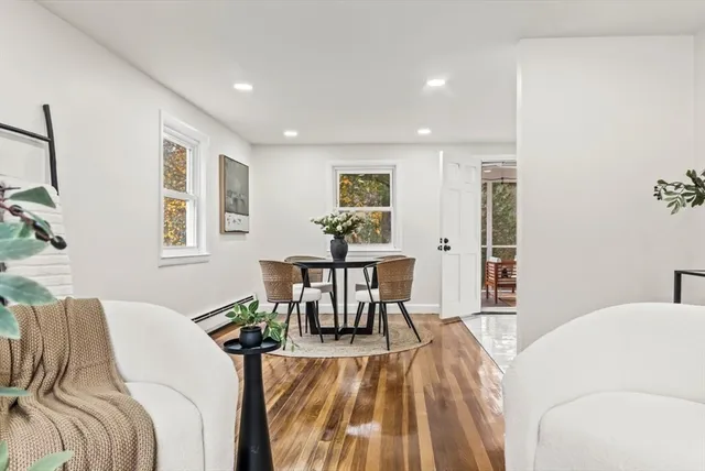 a bed room with a bed and a table chair