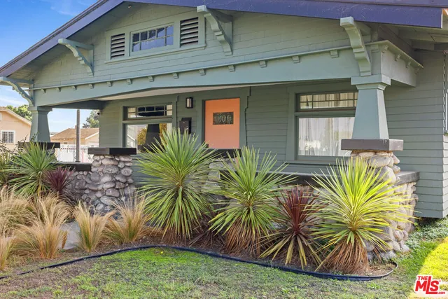 a view of front door and potted plants