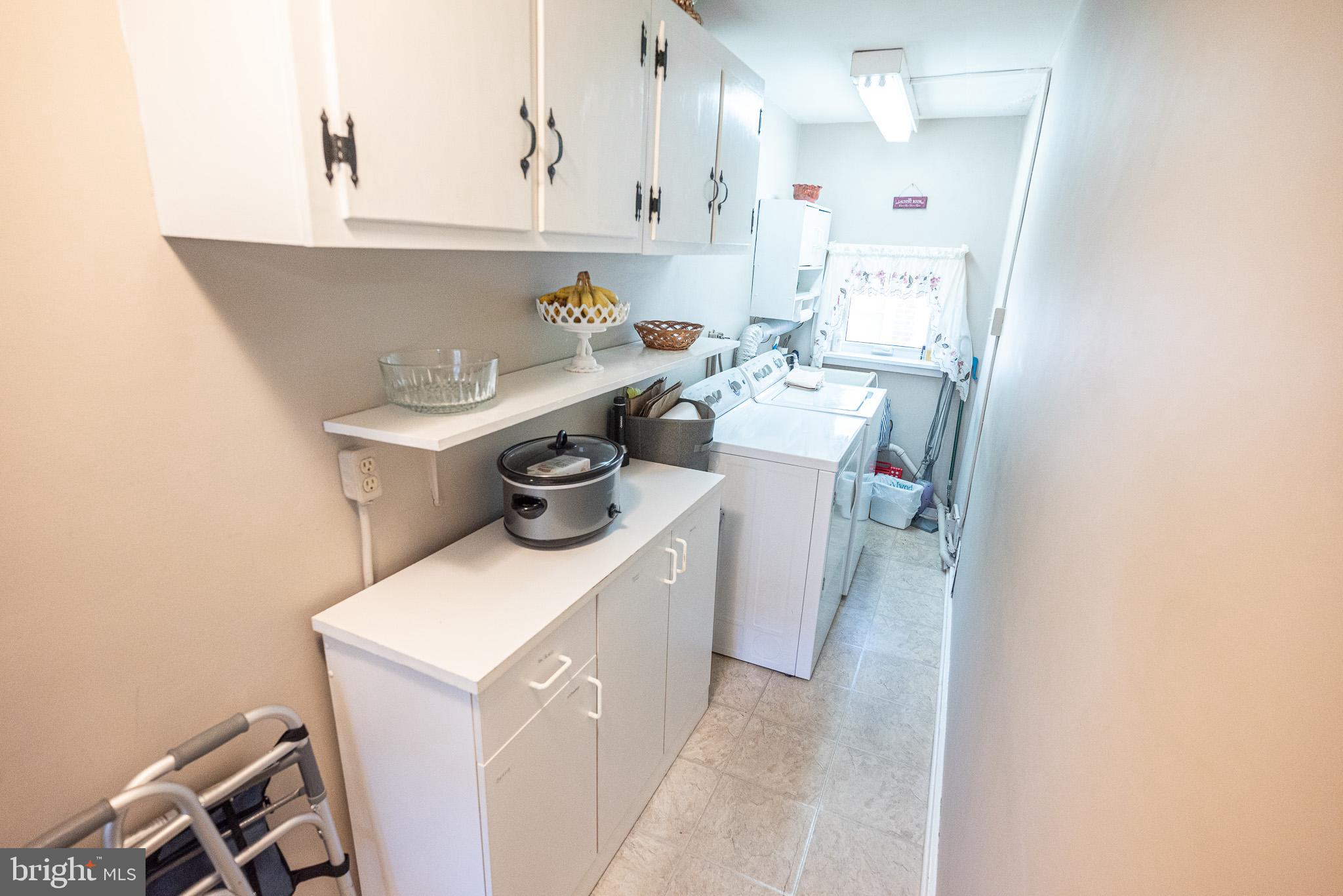 320 Valley View Road Media, PA 19063 - Photo 12 of 34 a utility room with sink dryer and washer