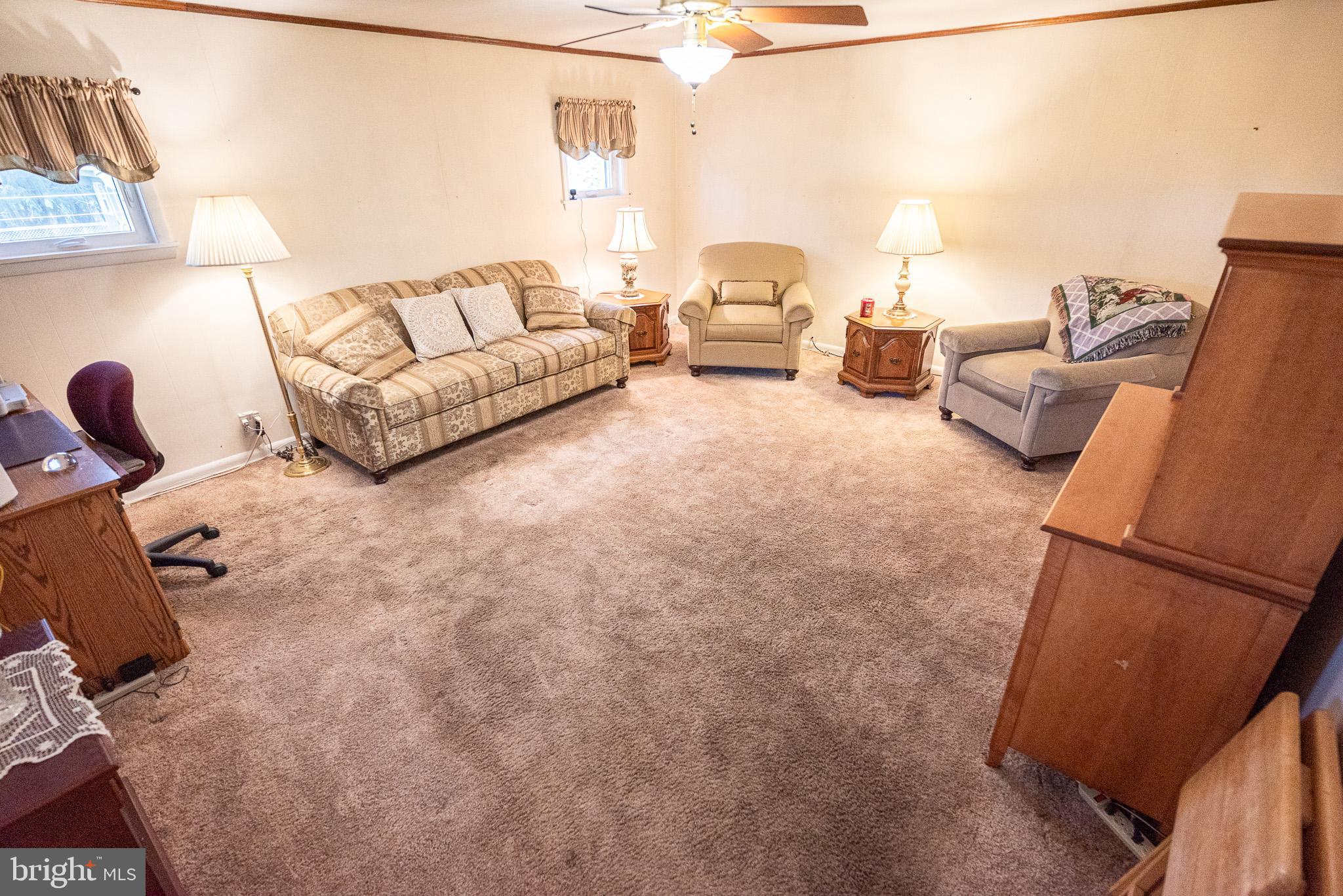 320 Valley View Road Media, PA 19063 - Photo 13 of 34 a living room with furniture and a couch