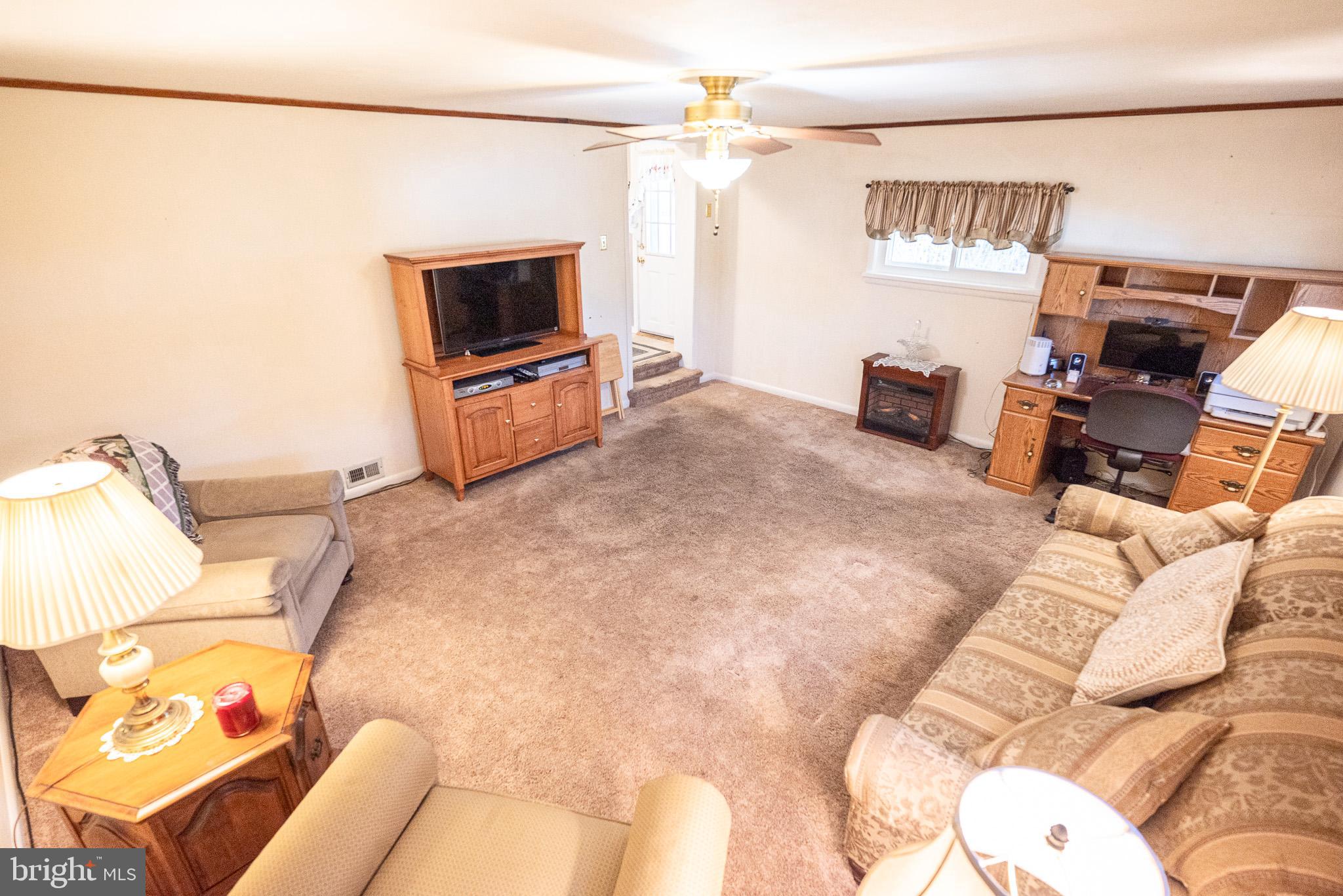 320 Valley View Road Media, PA 19063 - Photo 14 of 34 a living room with furniture and a flat screen tv