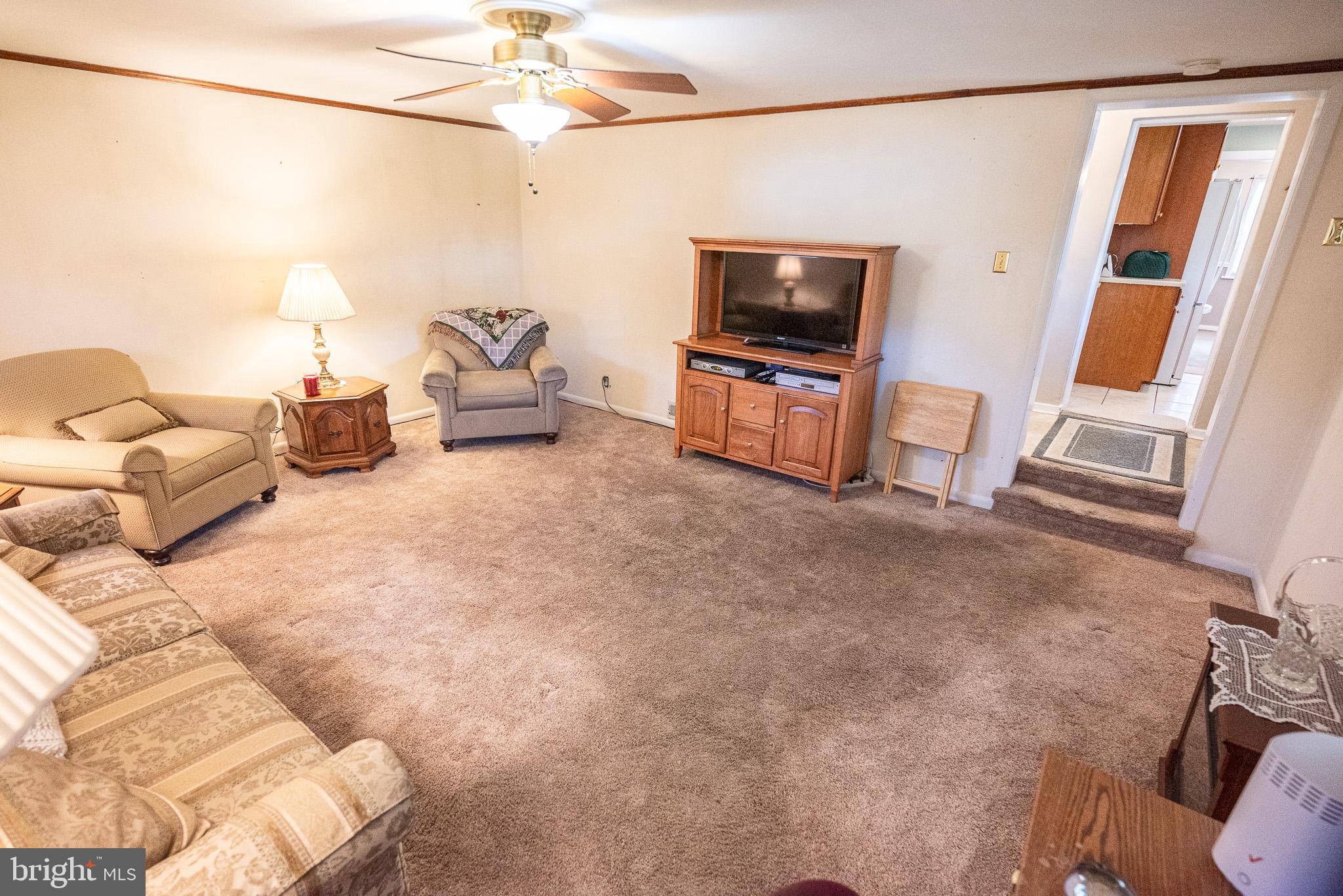 320 Valley View Road Media, PA 19063 - Photo 15 of 34 a living room with furniture a flat screen tv and a window