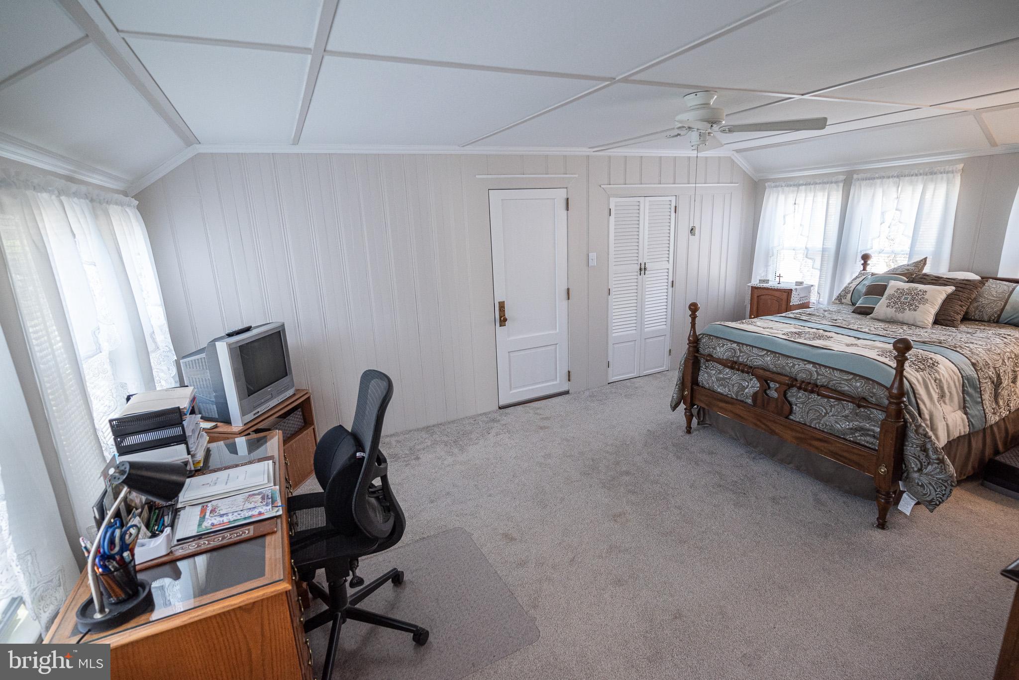 320 Valley View Road Media, PA 19063 - Photo 19 of 34 a bedroom with a bed a desk and chair