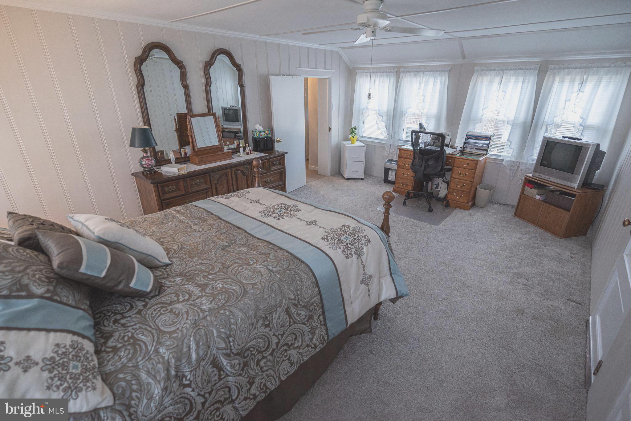 320 Valley View Road Media, PA 19063 - Photo 20 of 34 a bed room with a bed and mirror