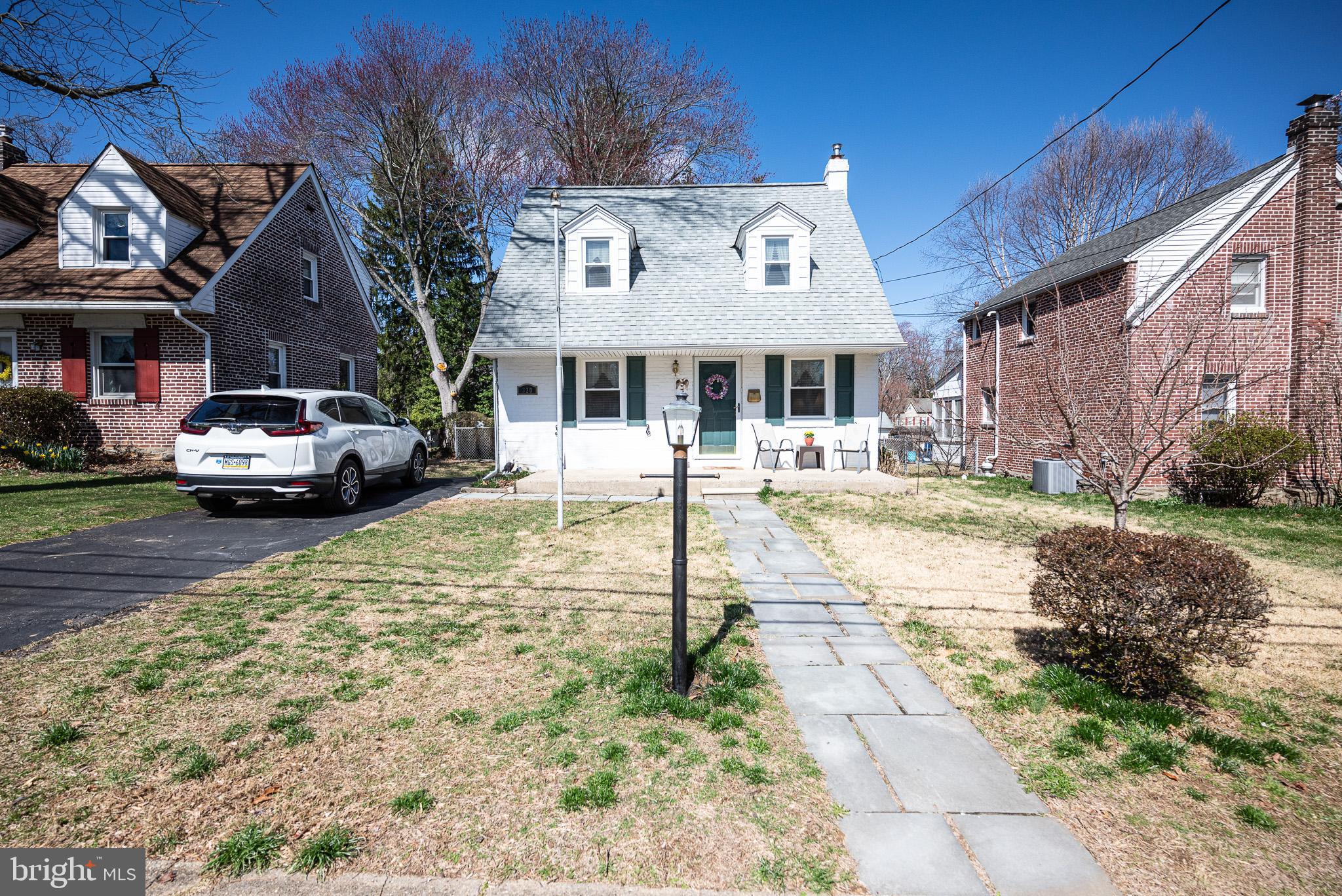320 Valley View Road Media, PA 19063 - Photo 3 of 34 a front view of a building with a garden and parking