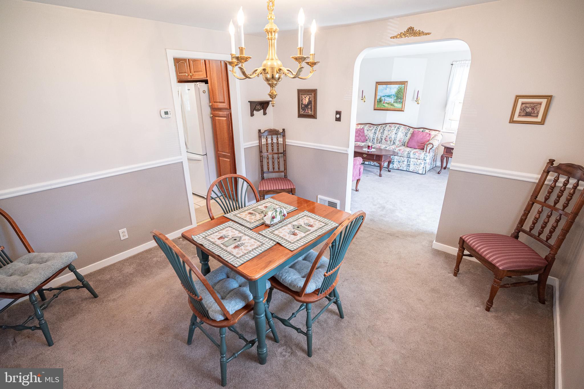 320 Valley View Road Media, PA 19063 - Photo 7 of 34 a living room with furniture a rug and a table