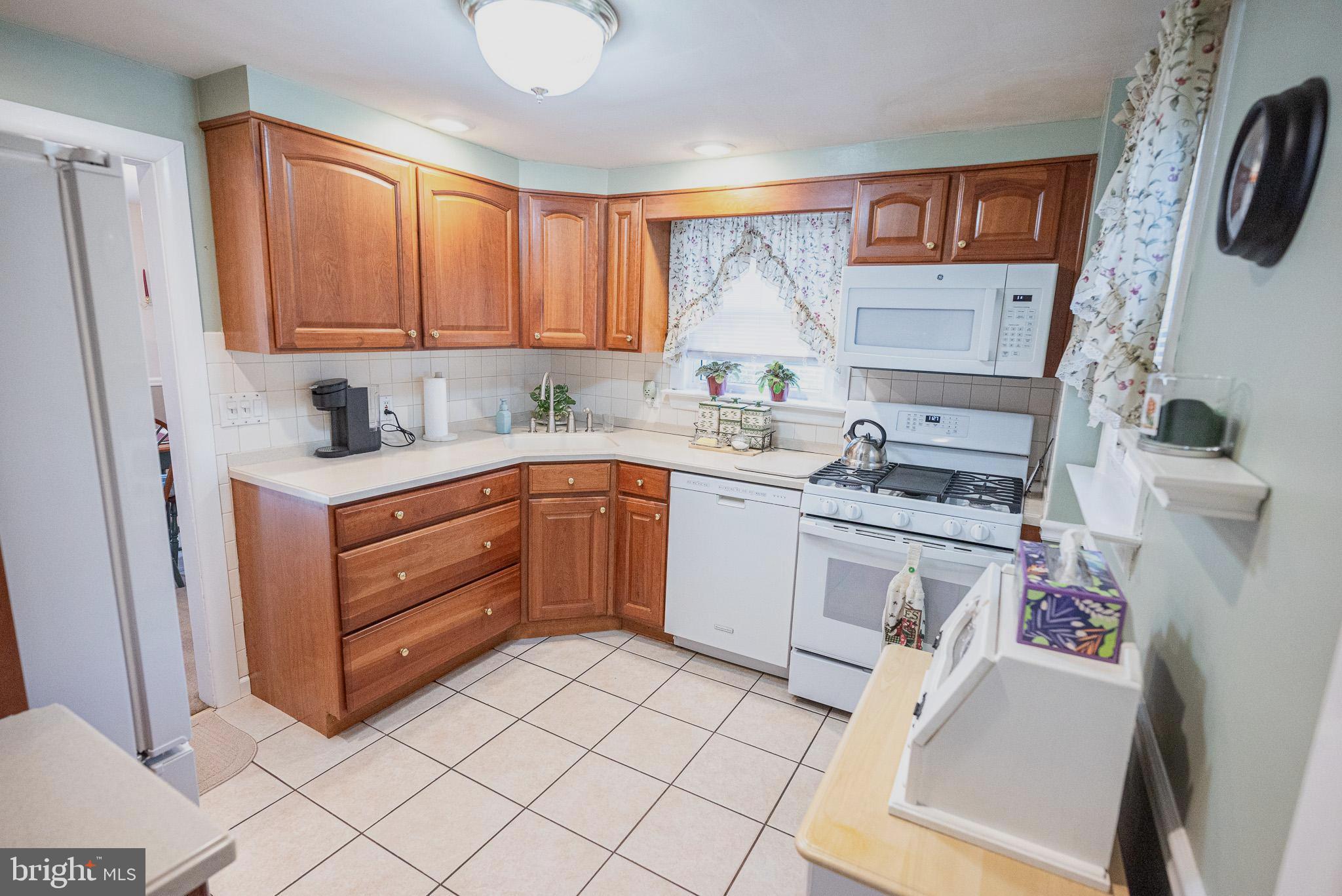 320 Valley View Road Media, PA 19063 - Photo 9 of 34 a kitchen with a sink cabinets and window