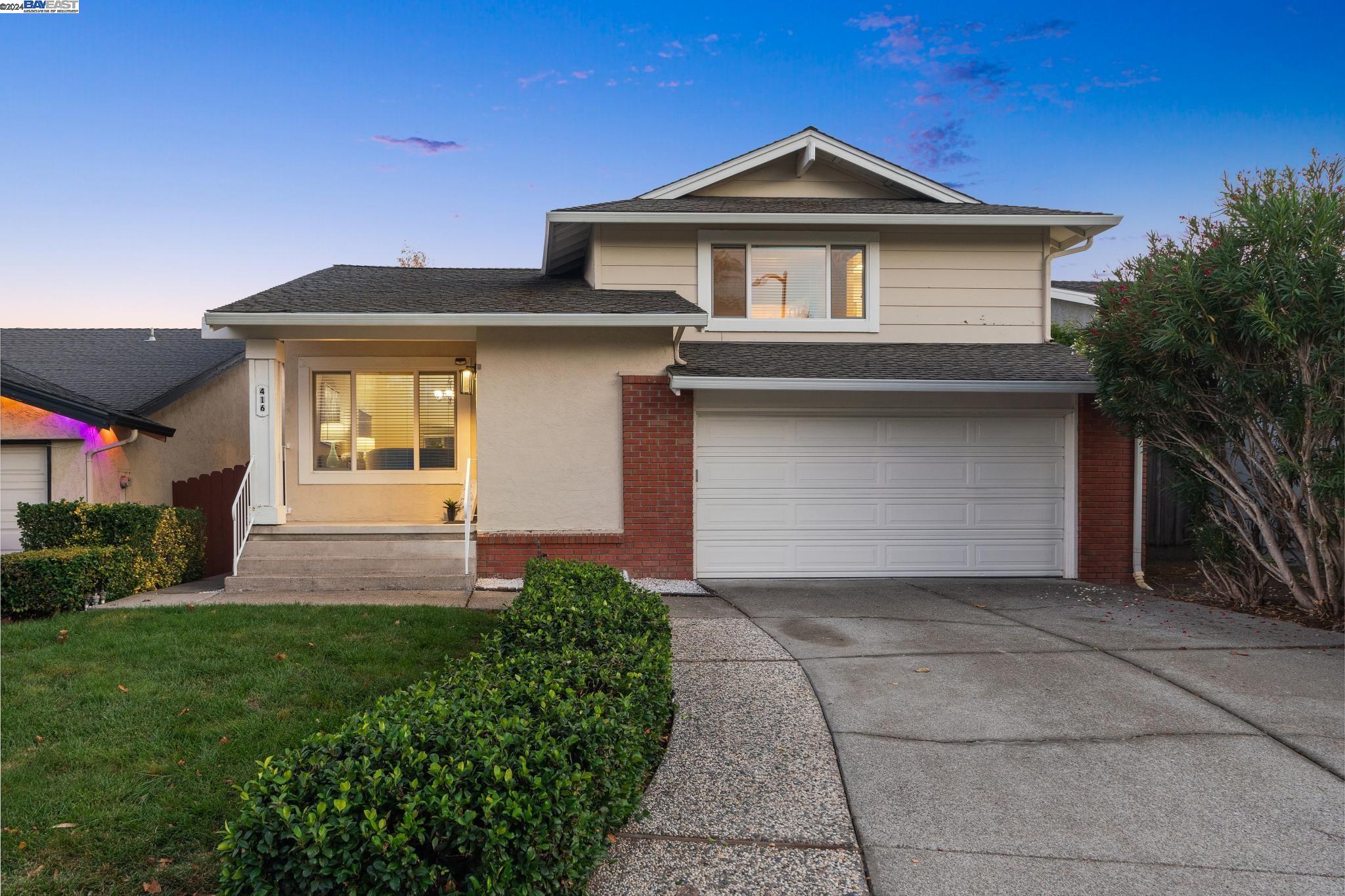 416 Santander Drive San Ramon, CA 94583 - Photo 1 of 1 a front view of a house with a yard and garage
