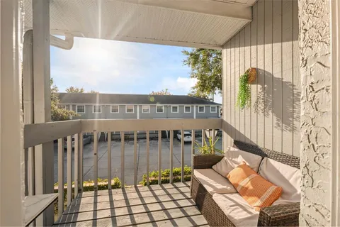 a view of a hallway with seating area