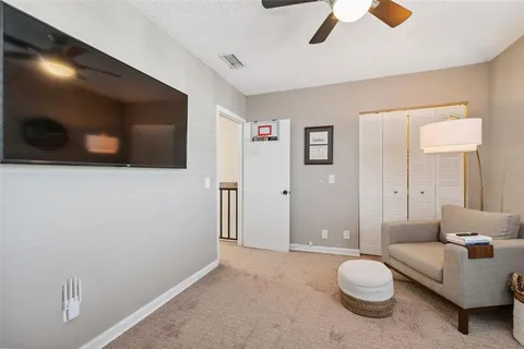 an aerial view of a house with a swimming pool