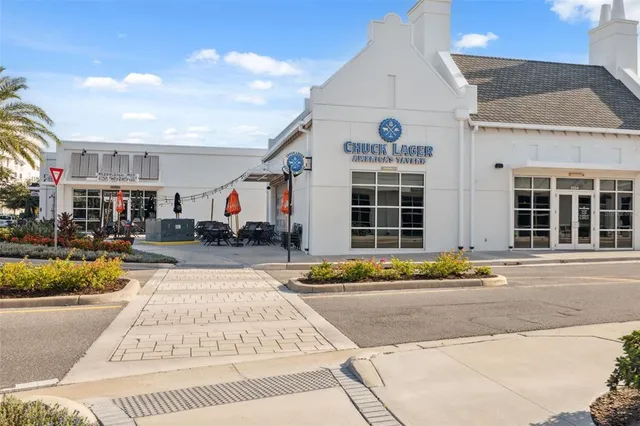 a building exterior with furniture and outdoor space