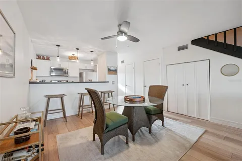 a living room with furniture a rug and a window