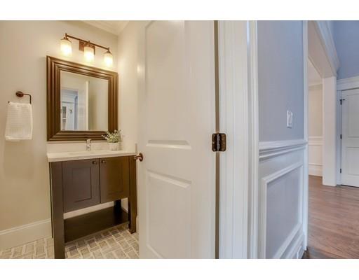 21 Fairhaven Road Newton, MA 02459 - Photo 11 of 30 a bathroom with a sink a mirror and a shower