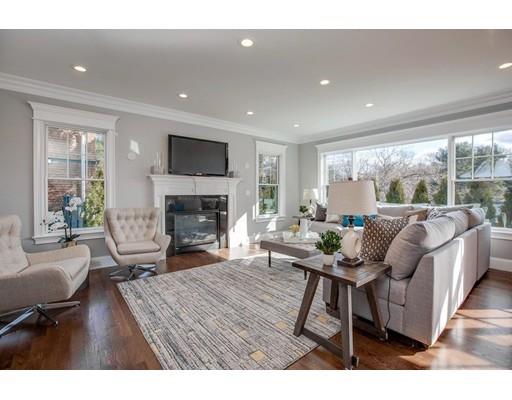 21 Fairhaven Road Newton, MA 02459 - Photo 20 of 30 a living room with furniture a fireplace and a flat screen tv
